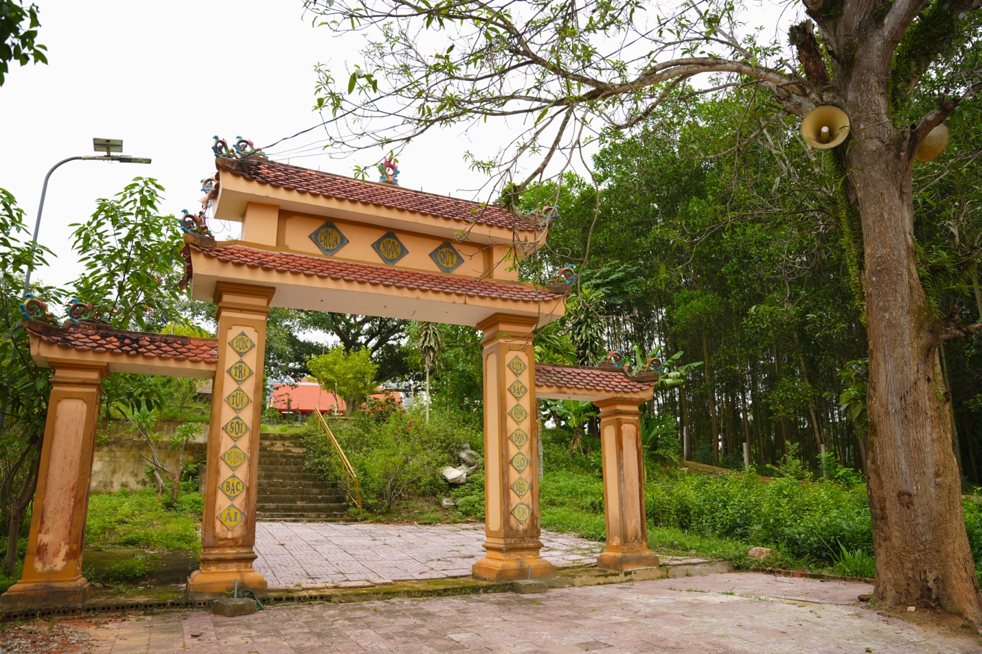 A gate with a red roof Description automatically generated with medium confidence