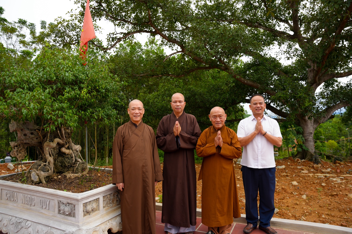 A group of men standing together Description automatically generated