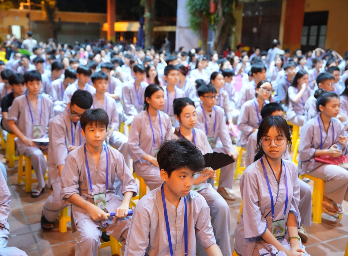 A group of children sitting in chairs AI-generated content may be incorrect.
