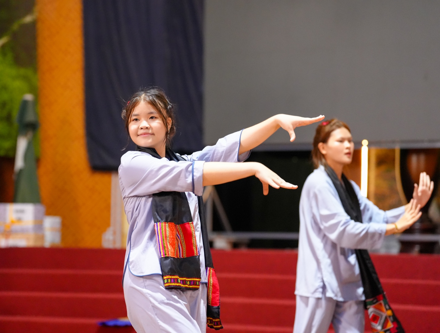 A group of girls dancing on stage AI-generated content may be incorrect.