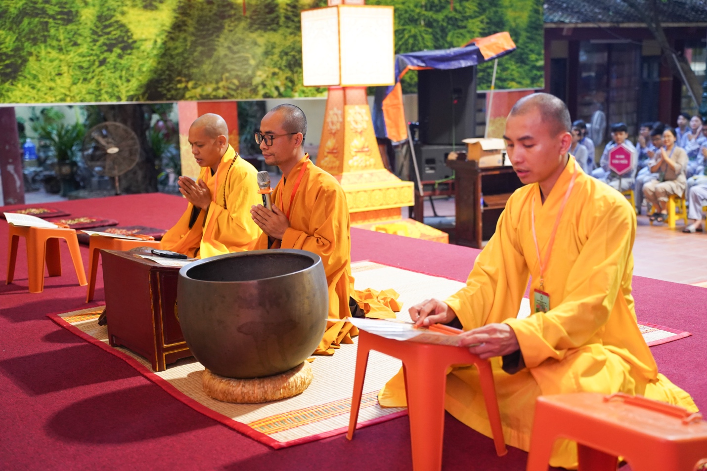 A group of men in yellow robes AI-generated content may be incorrect.