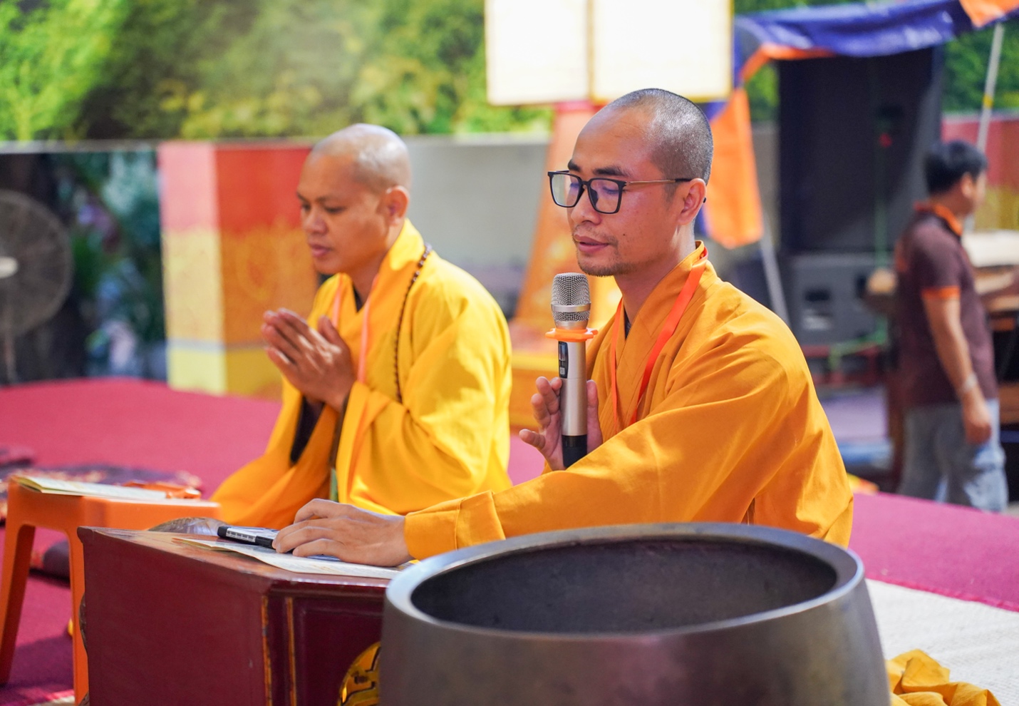 A group of men in yellow robes AI-generated content may be incorrect.