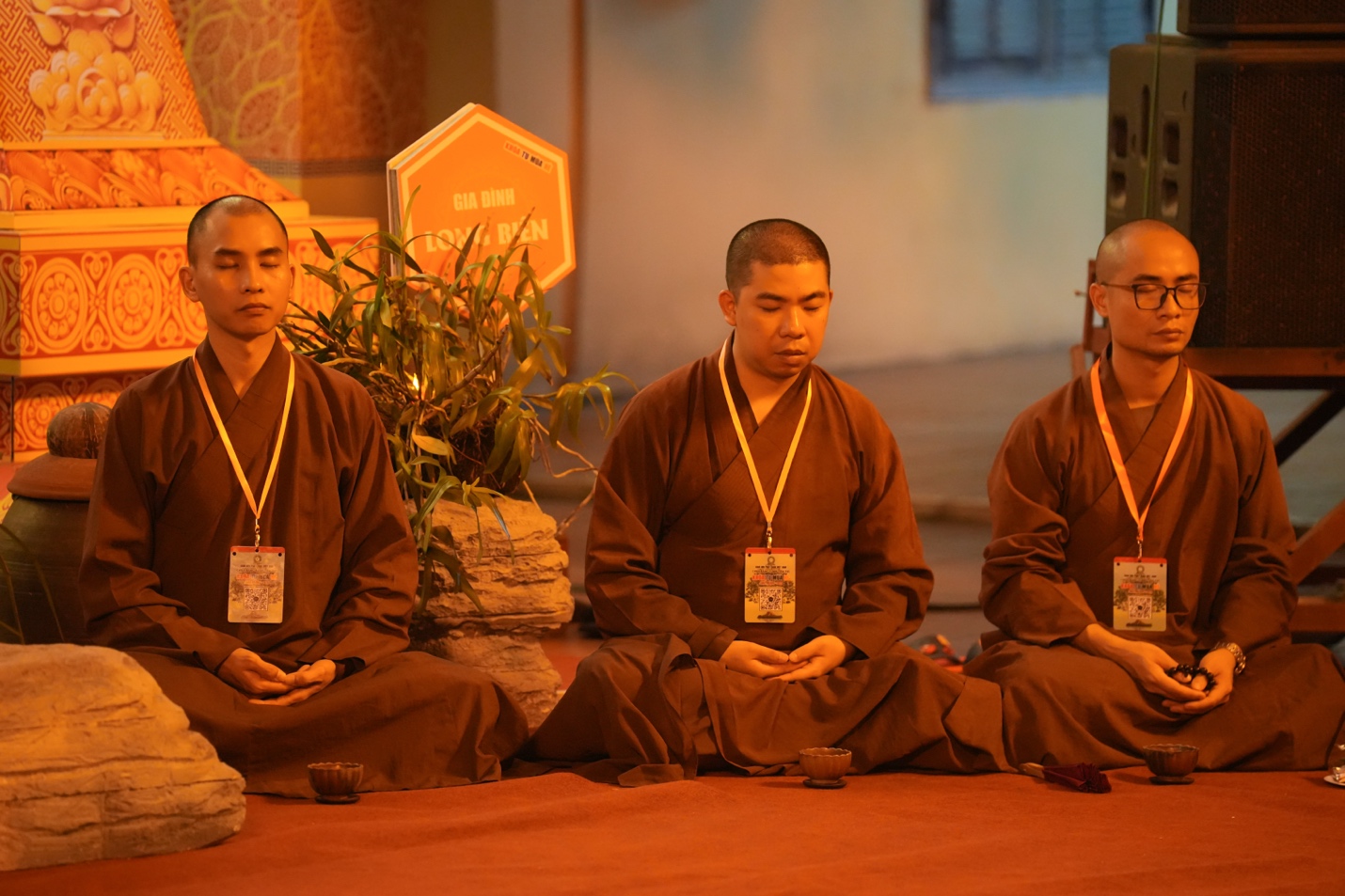 A group of men sitting on the floor AI-generated content may be incorrect.