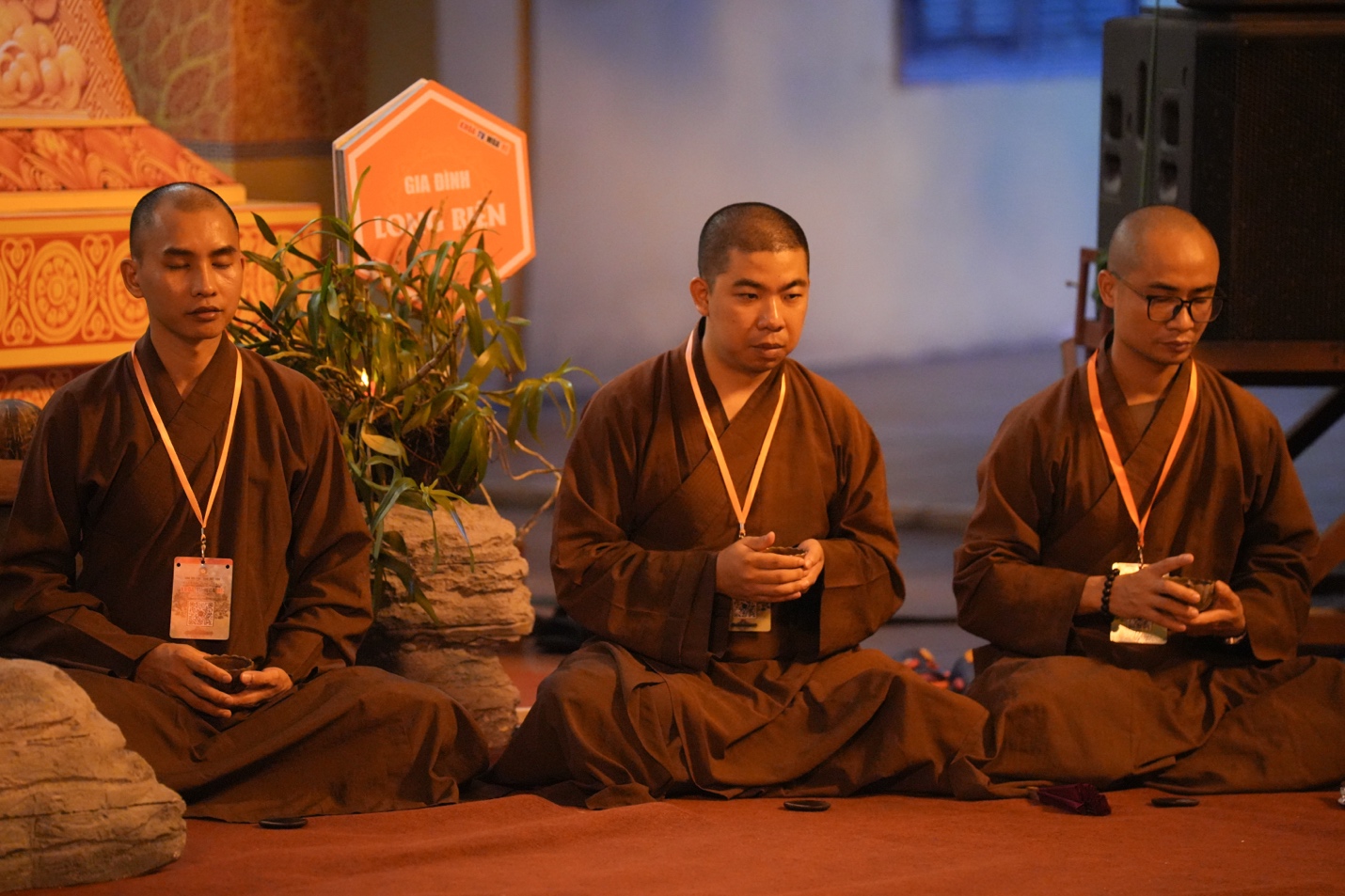 A group of men sitting on the floor AI-generated content may be incorrect.