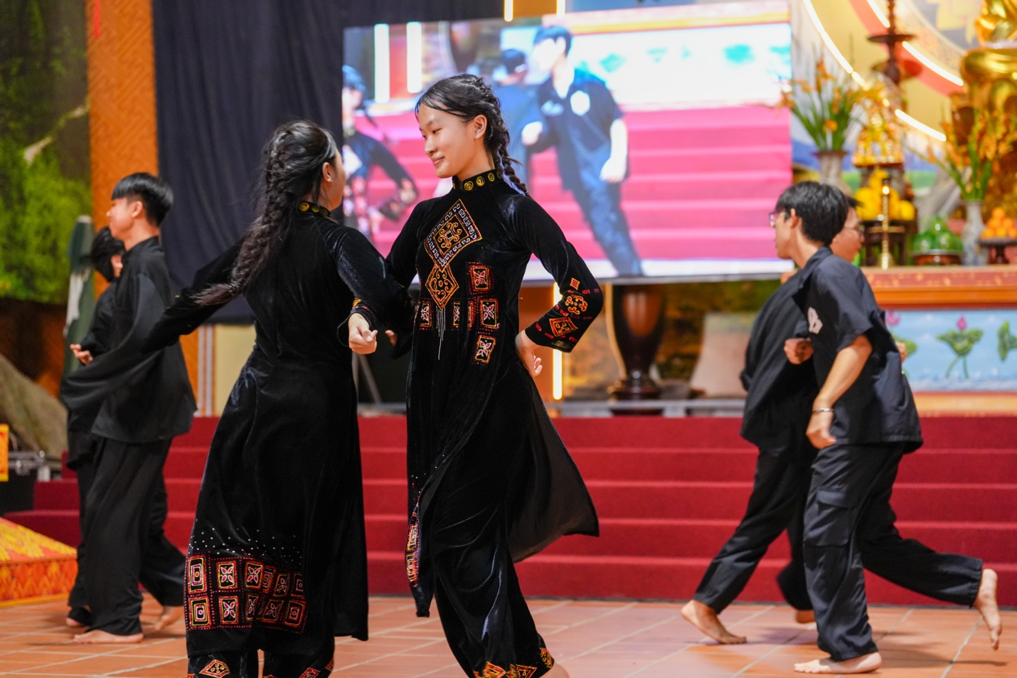 A group of people dancing AI-generated content may be incorrect.