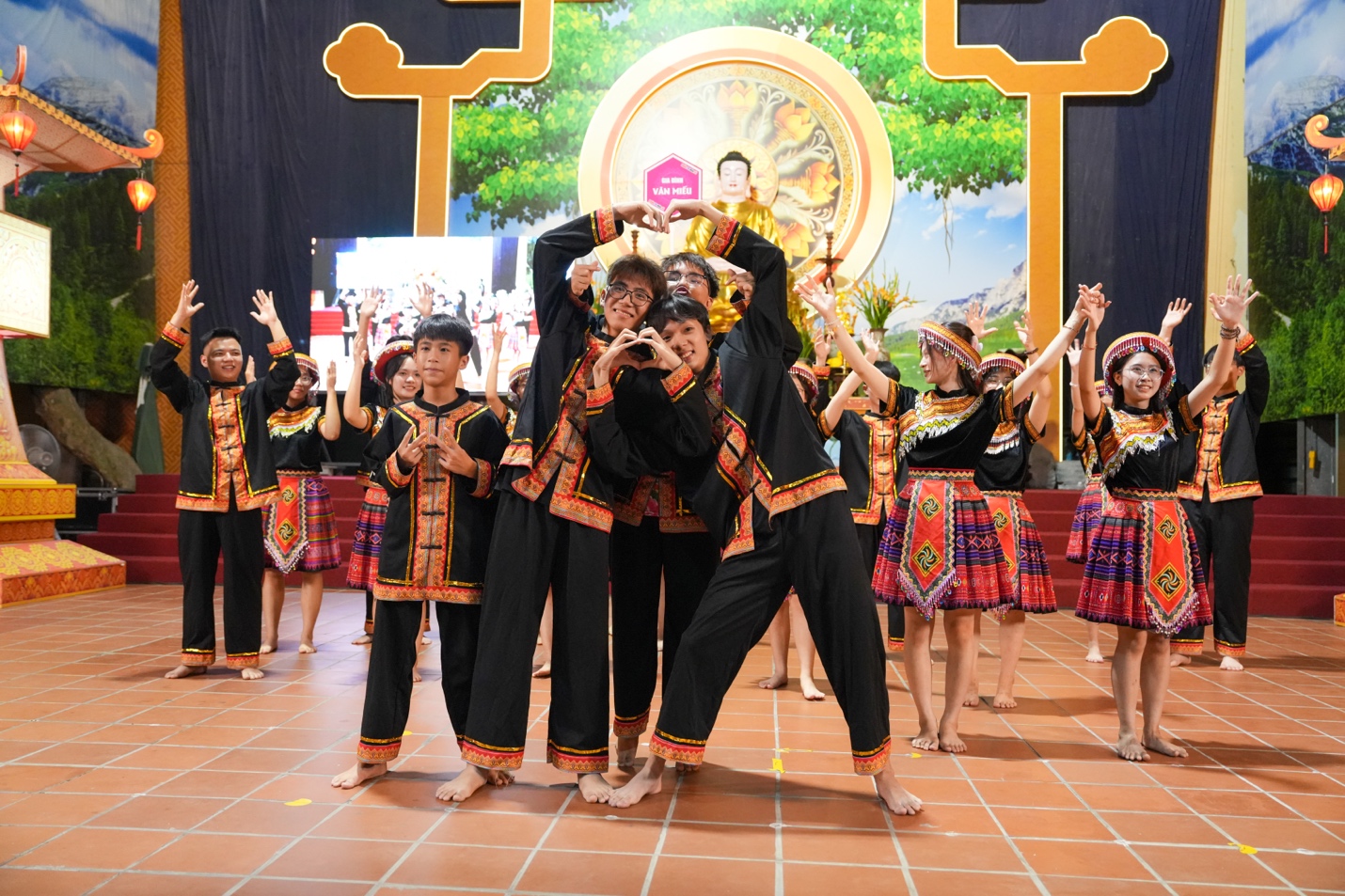 A group of people dancing on a stage AI-generated content may be incorrect.