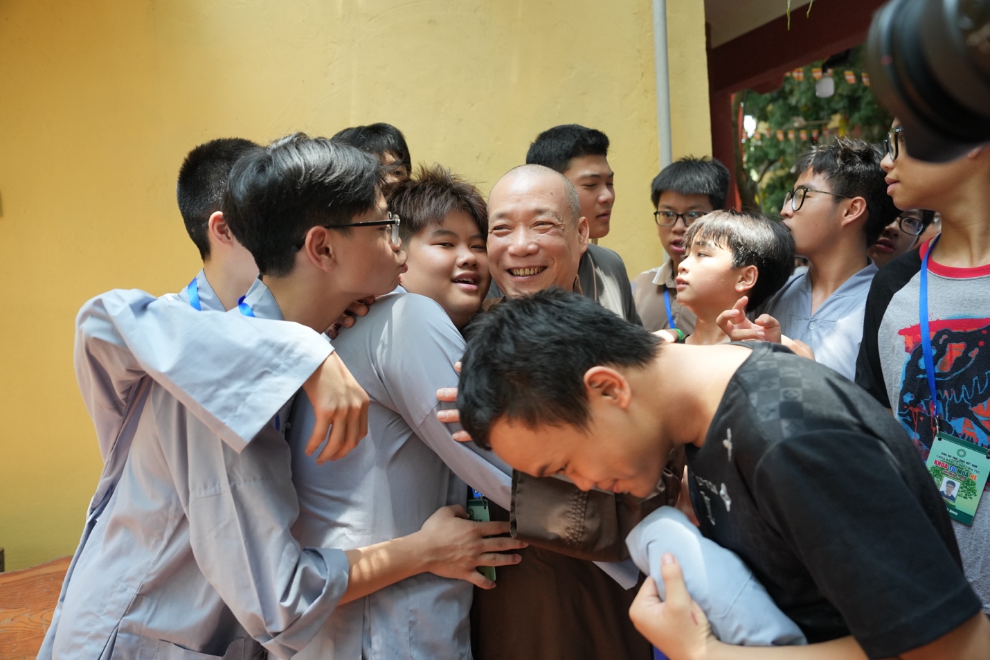 A group of people hugging each other AI-generated content may be incorrect.