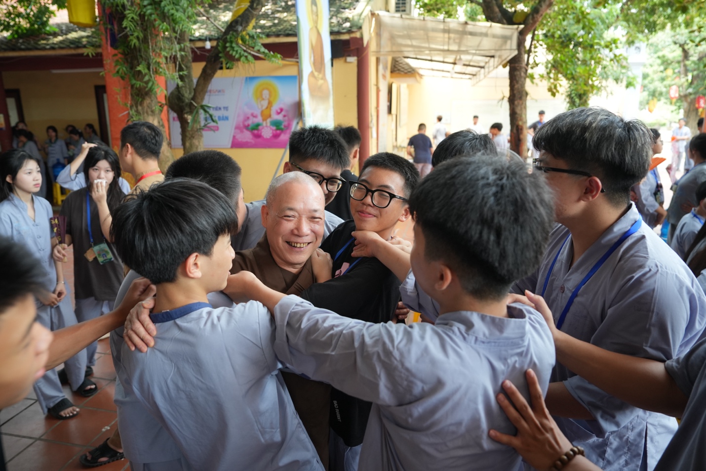A group of people hugging each other AI-generated content may be incorrect.