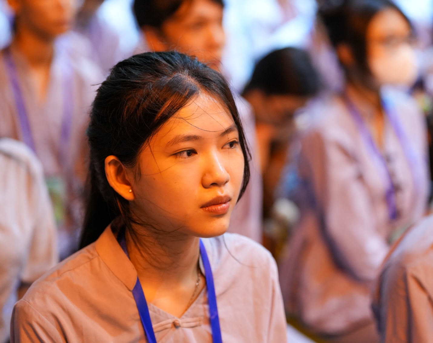 A group of people in a row AI-generated content may be incorrect.
