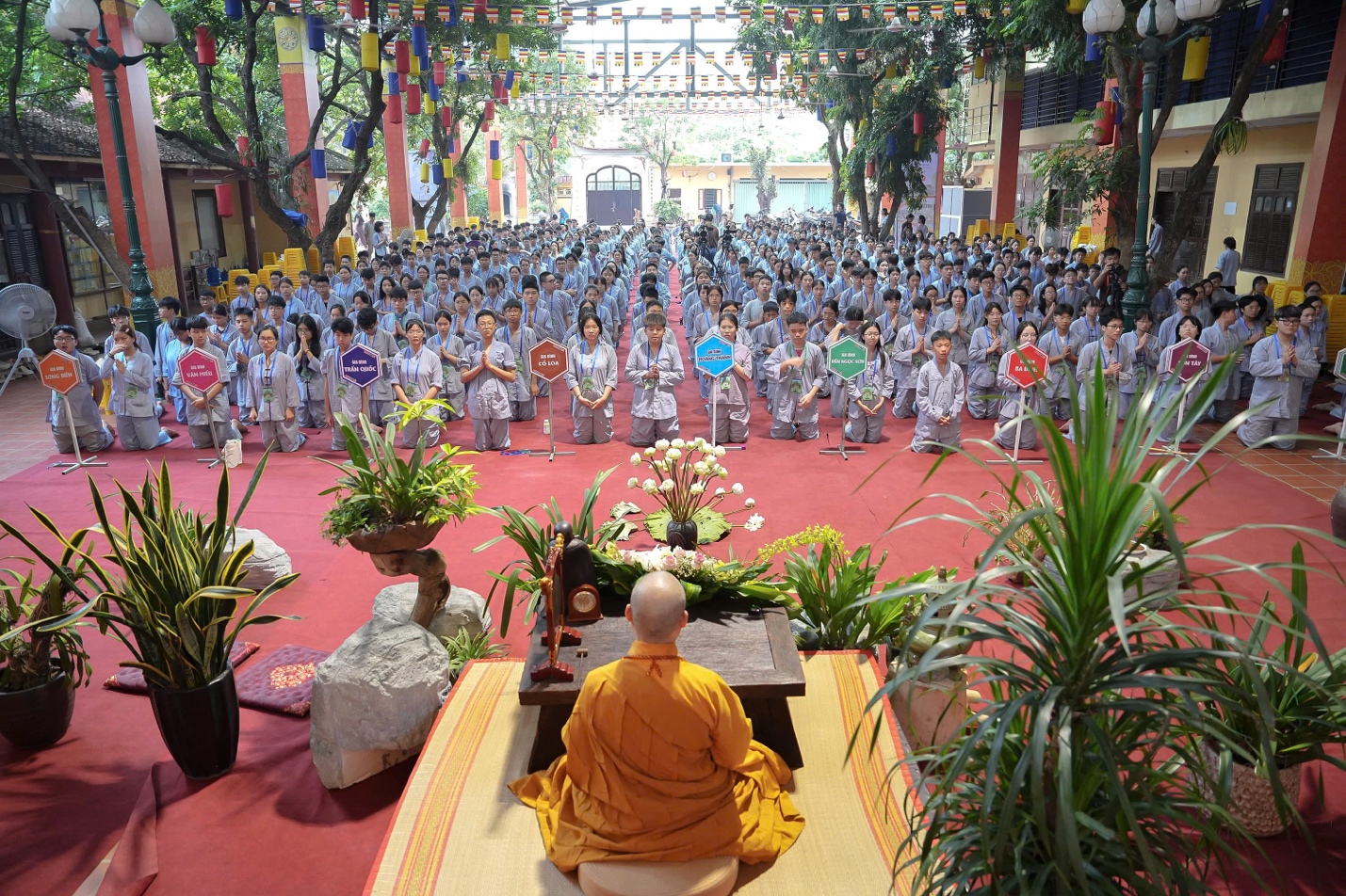 A group of people in a temple AI-generated content may be incorrect.