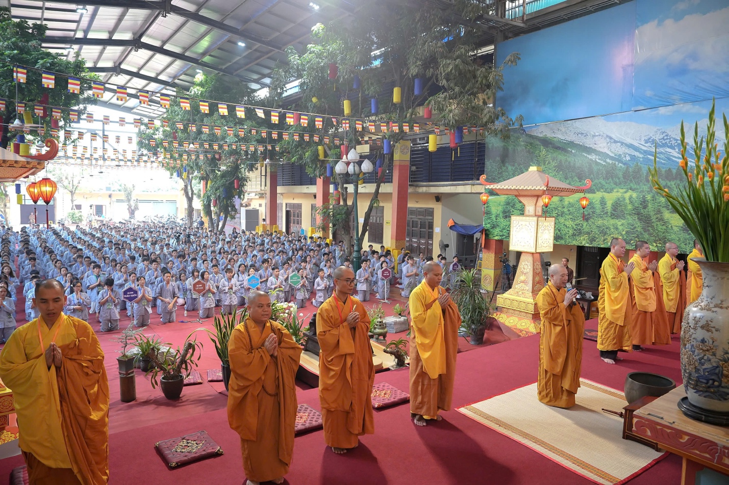 A group of people in orange robes AI-generated content may be incorrect.