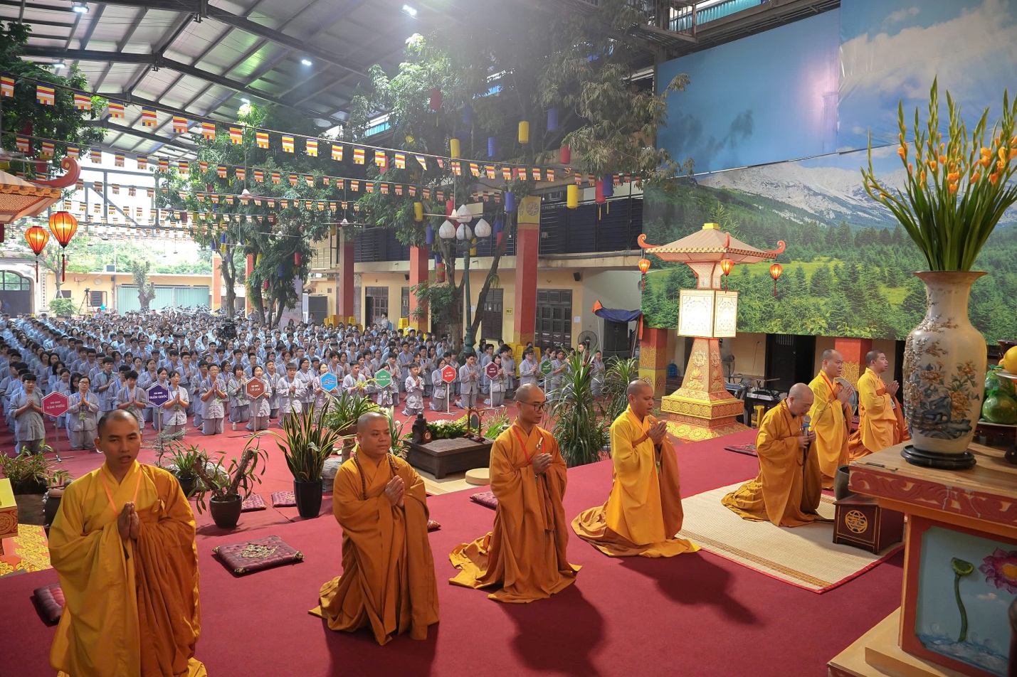 A group of people in yellow robes AI-generated content may be incorrect.