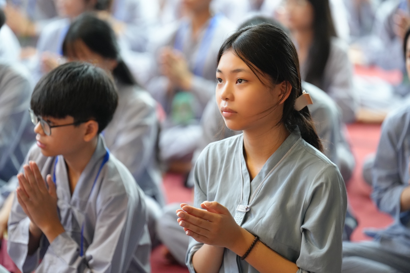 A group of people praying

AI-generated content may be incorrect.