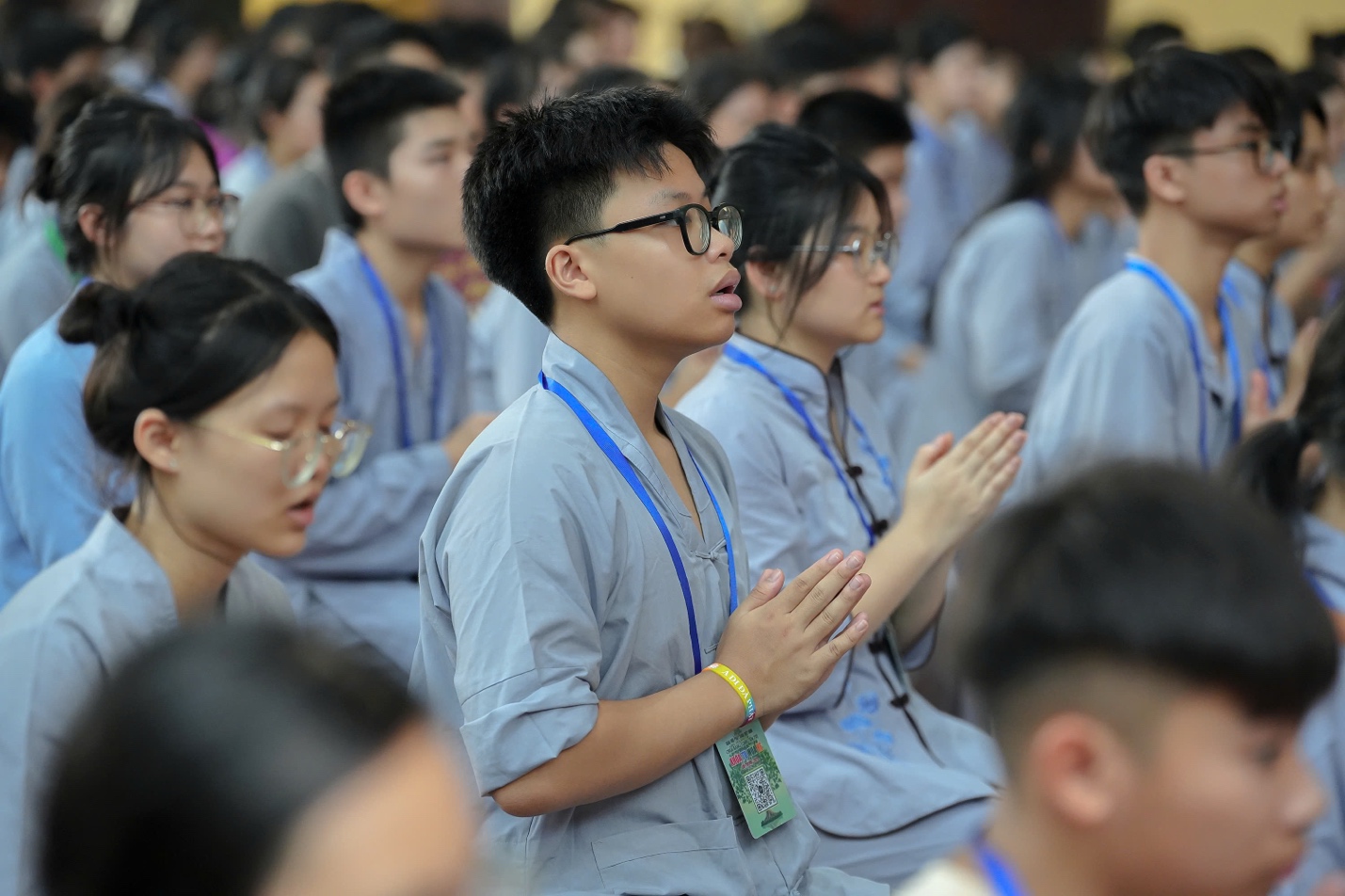 A group of people praying AI-generated content may be incorrect.