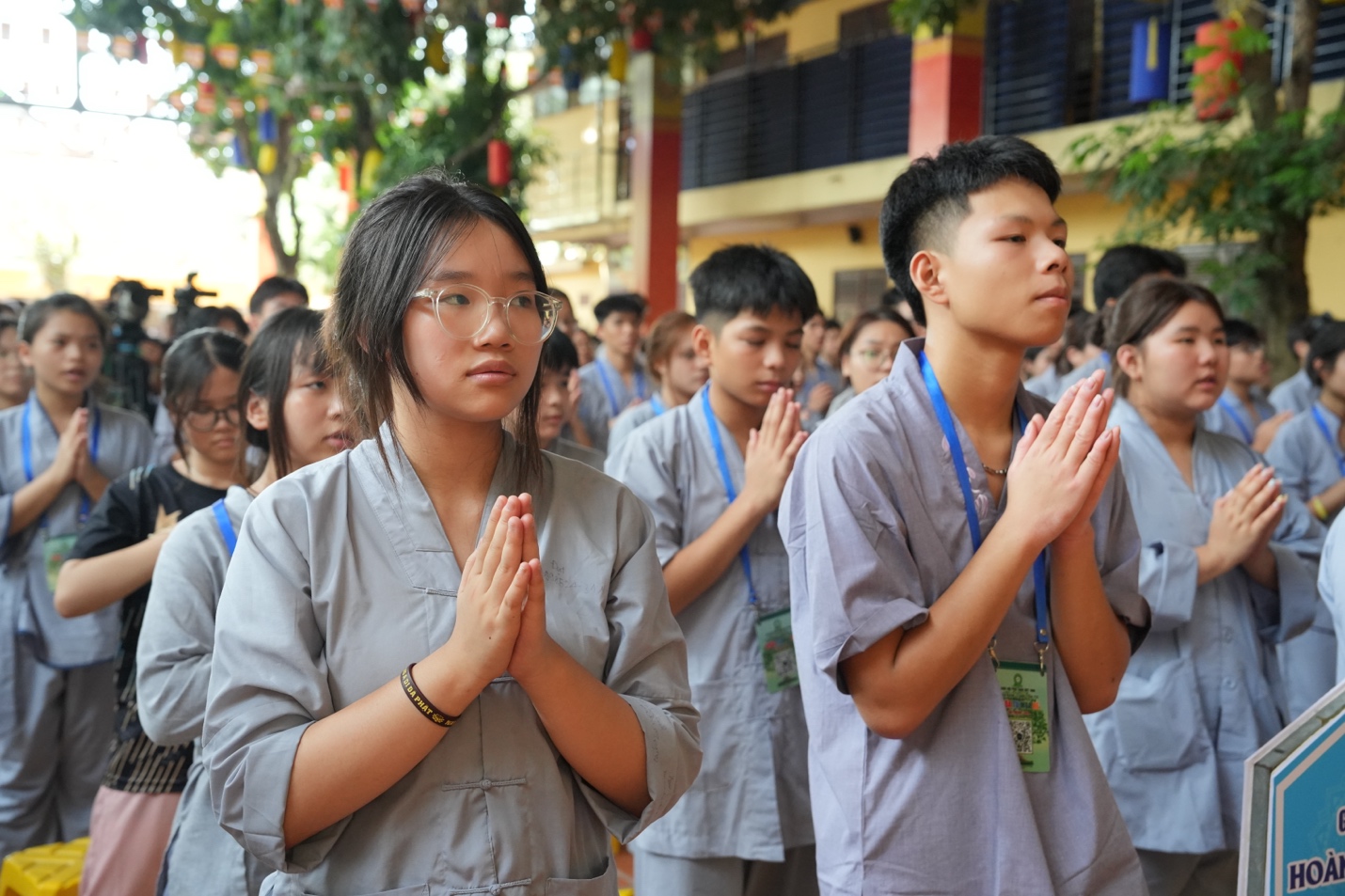 A group of people praying AI-generated content may be incorrect.
