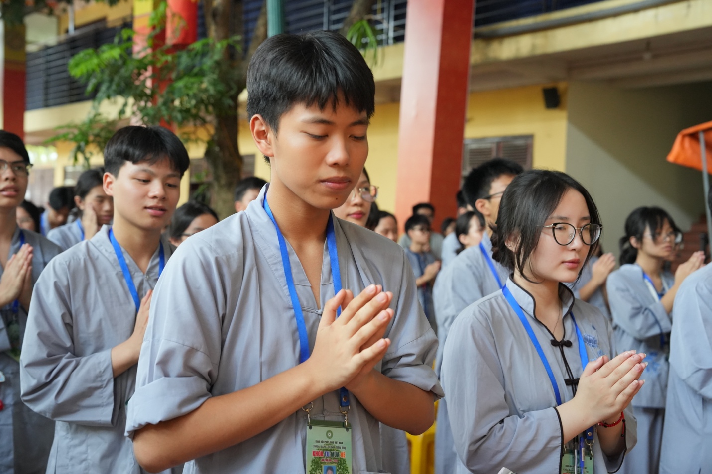 A group of people praying AI-generated content may be incorrect.