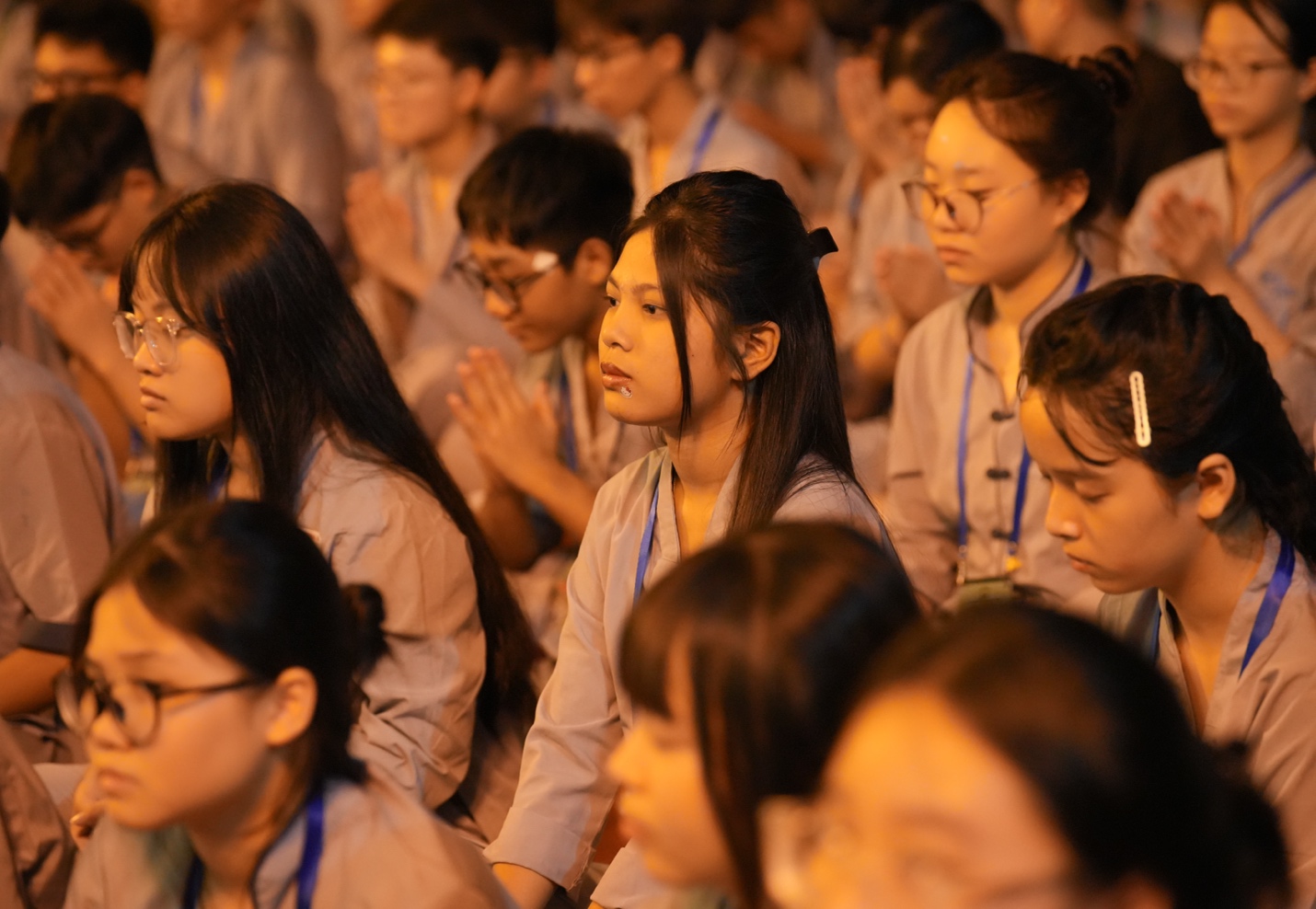 A group of people praying AI-generated content may be incorrect.