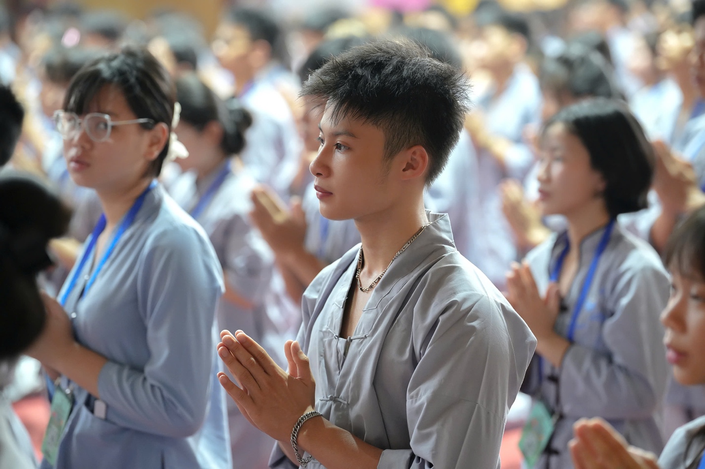 A group of people praying AI-generated content may be incorrect.