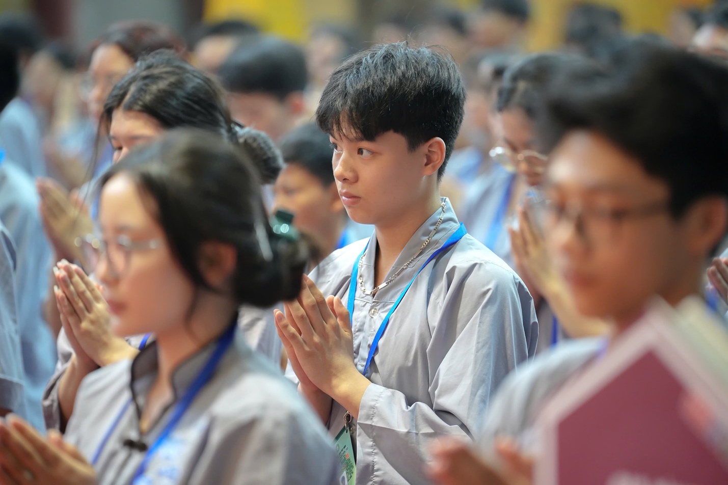 A group of people praying AI-generated content may be incorrect.