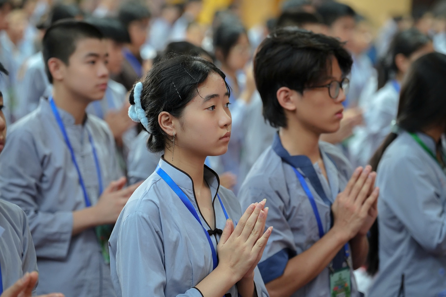 A group of people praying AI-generated content may be incorrect.