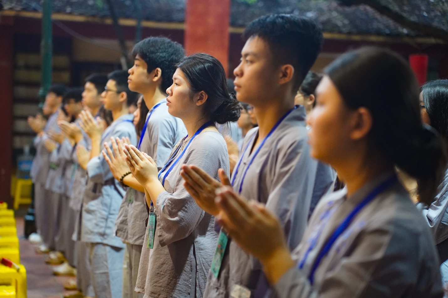 A group of people praying AI-generated content may be incorrect.