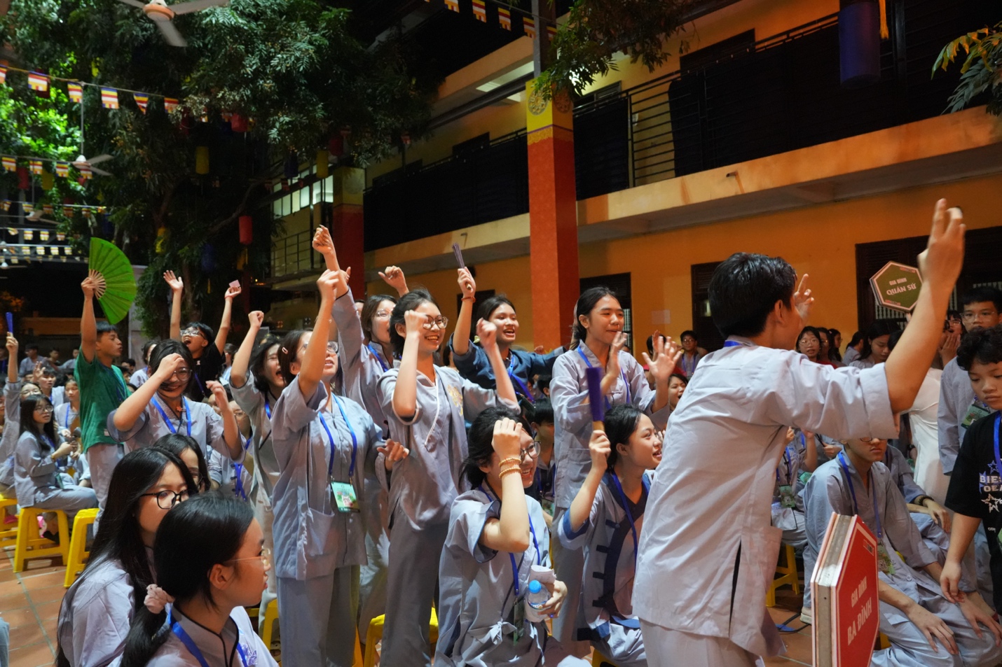 A group of people raising their hands AI-generated content may be incorrect.