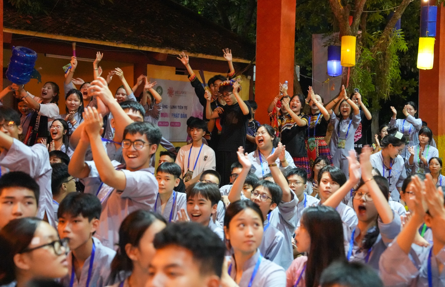 A group of people raising their hands AI-generated content may be incorrect.