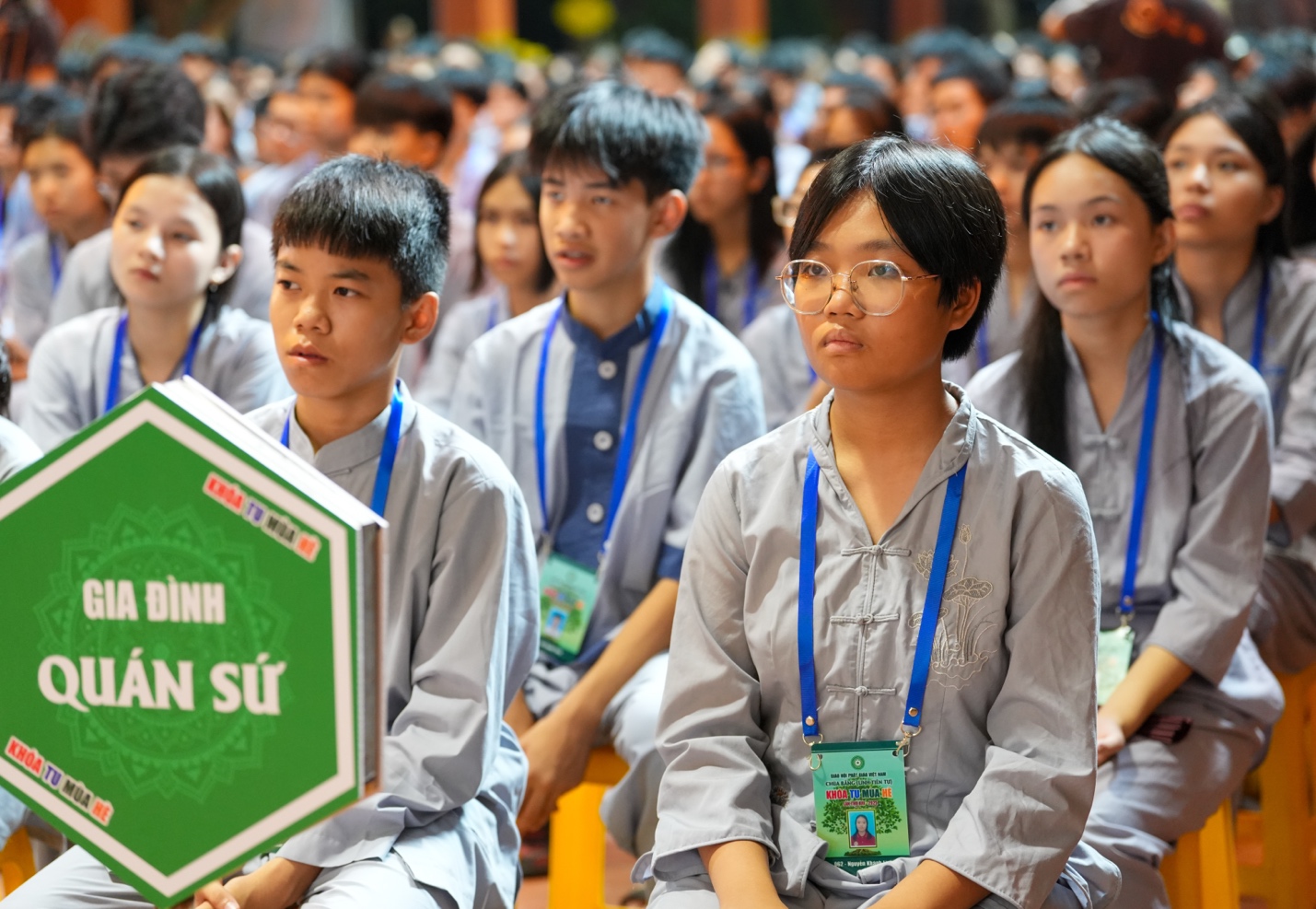 A group of people sitting in a room AI-generated content may be incorrect.