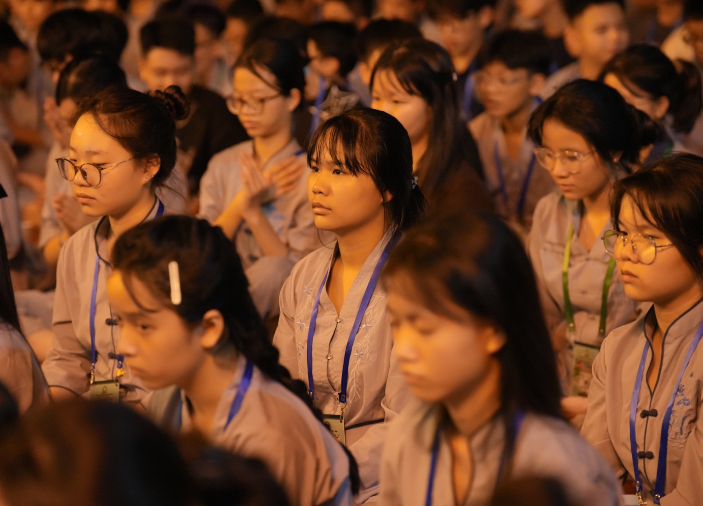 A group of people sitting in a room AI-generated content may be incorrect.