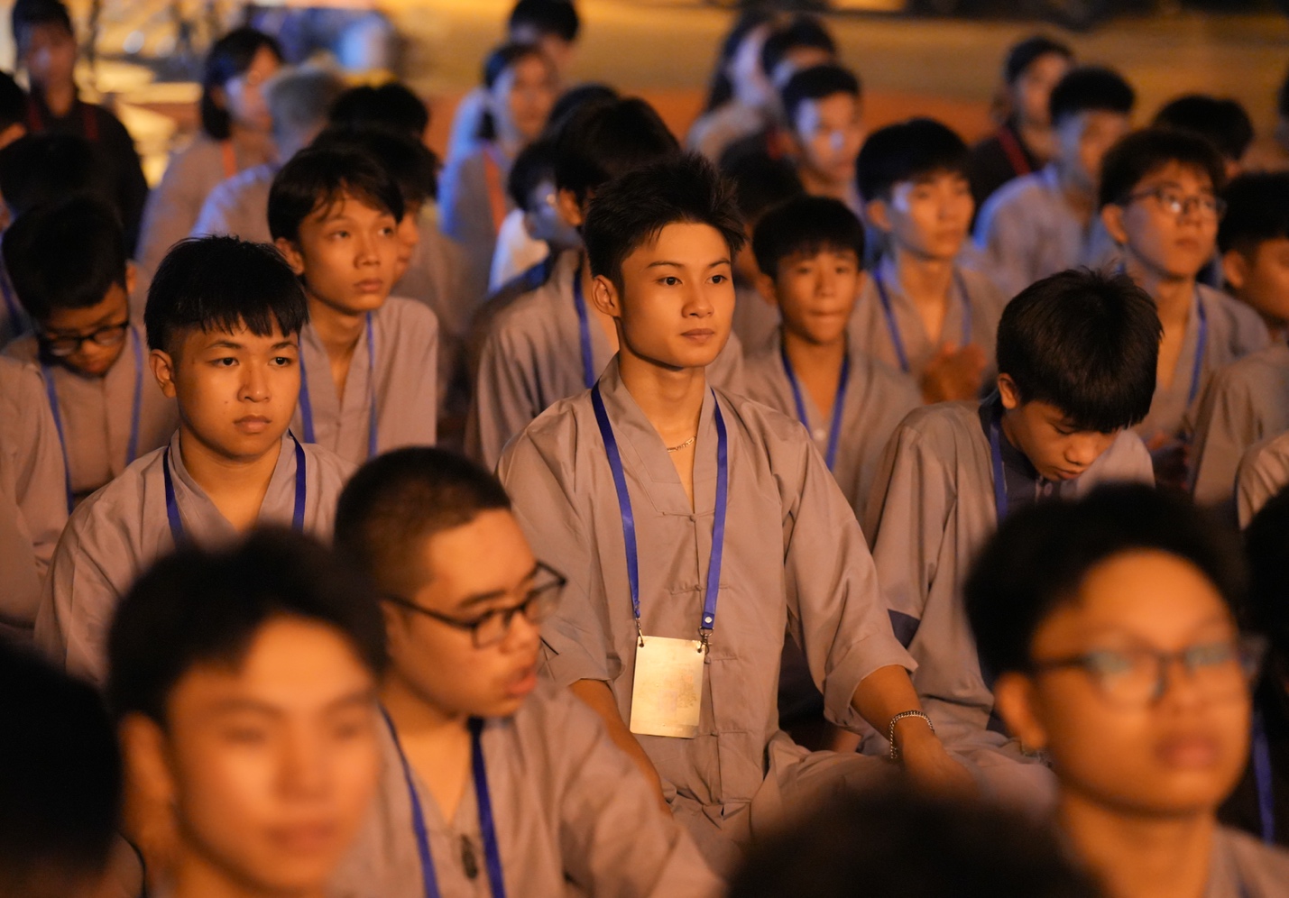 A group of people sitting in a room AI-generated content may be incorrect.