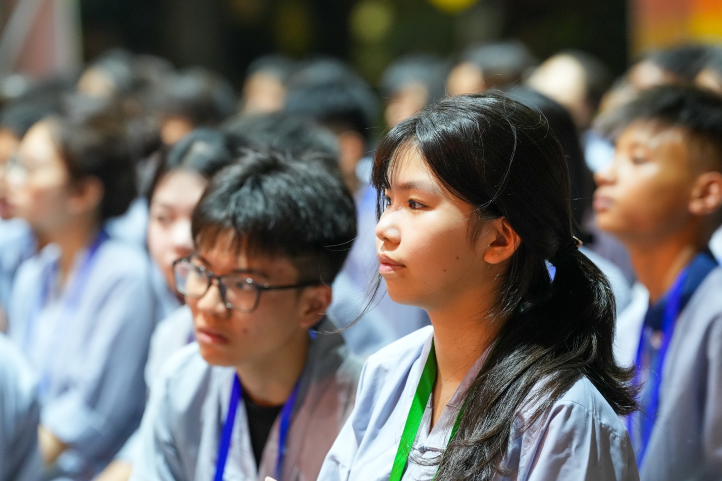 A group of people sitting in a room AI-generated content may be incorrect.