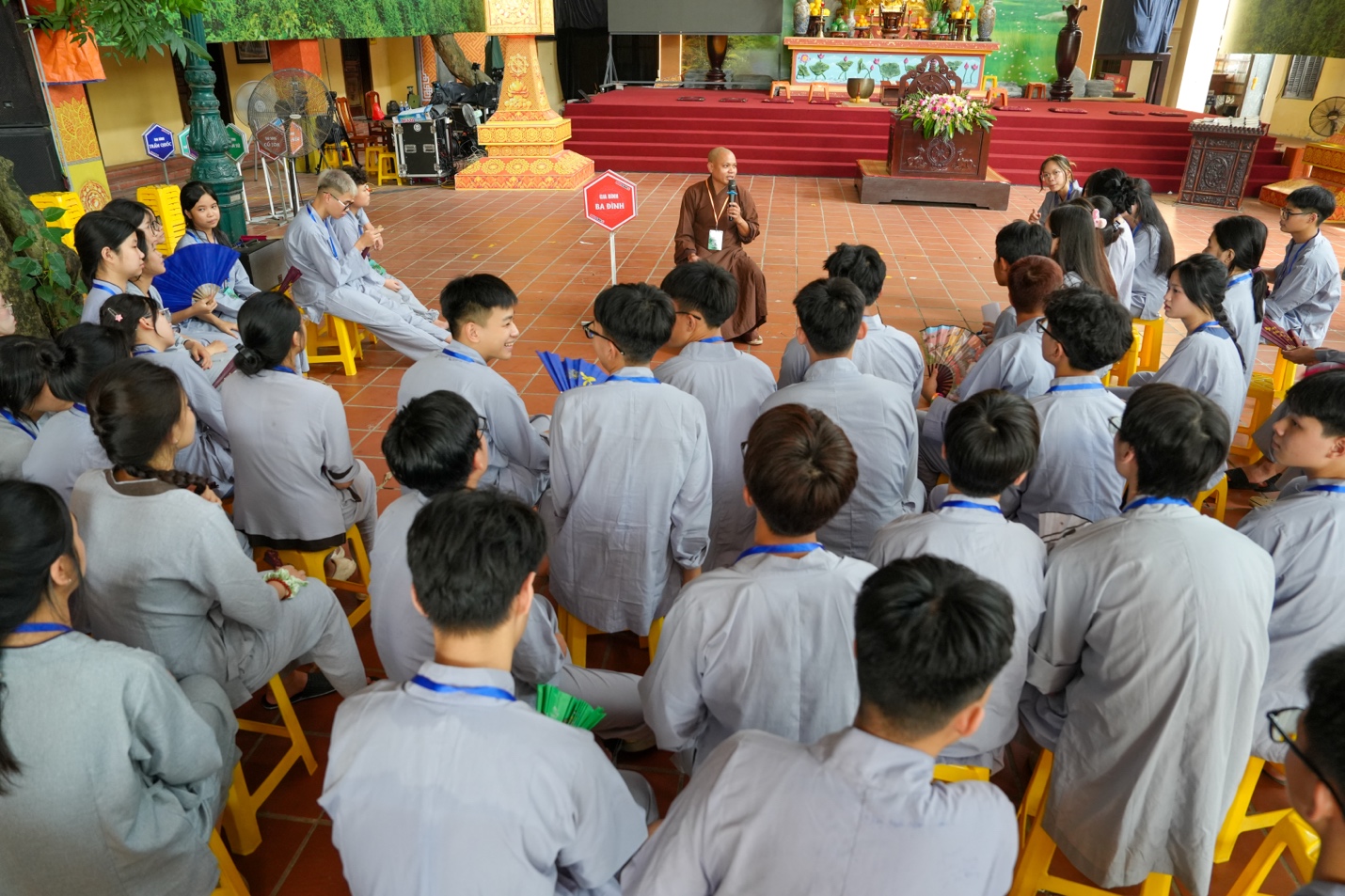A group of people sitting in chairs AI-generated content may be incorrect.