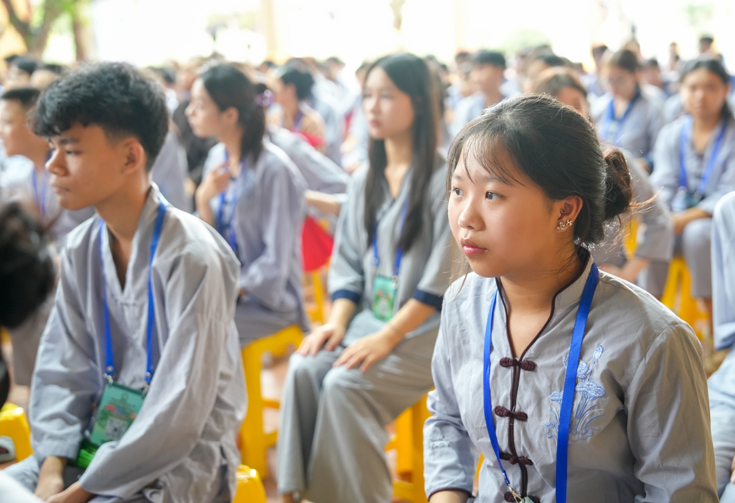 A group of people sitting in chairs AI-generated content may be incorrect.