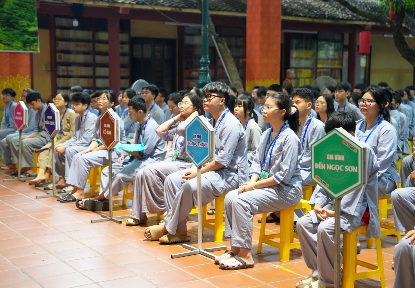 A group of people sitting on chairs AI-generated content may be incorrect.