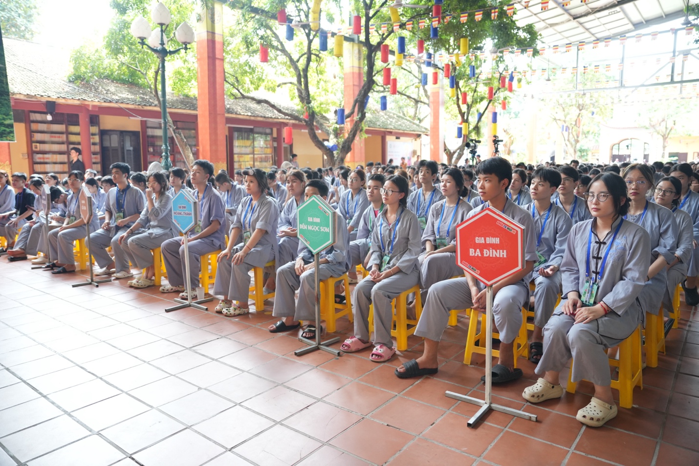 A group of people sitting on chairs AI-generated content may be incorrect.