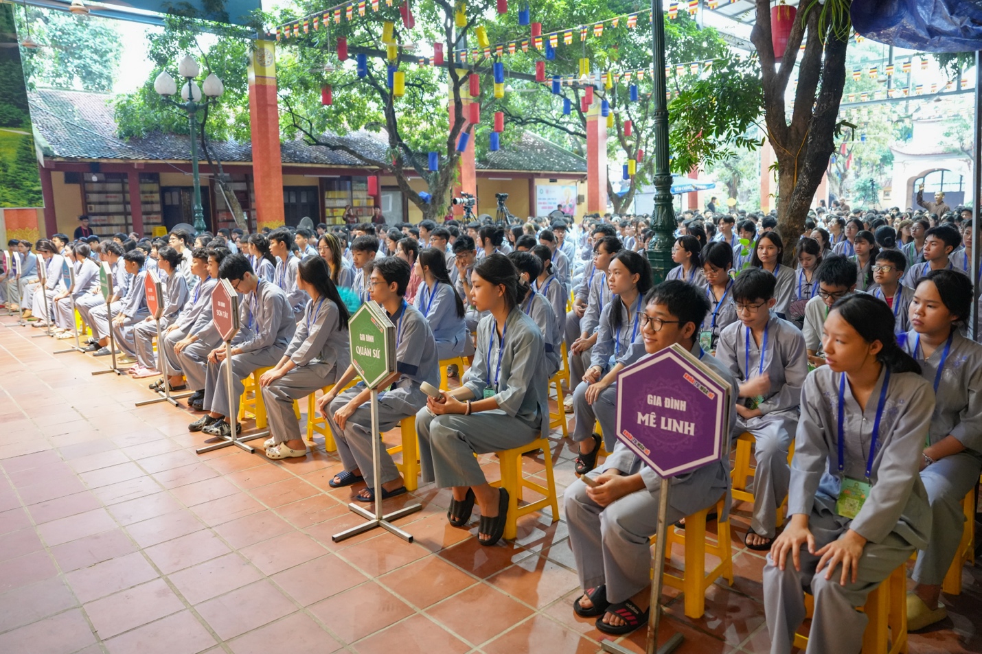 A group of people sitting on chairs AI-generated content may be incorrect.
