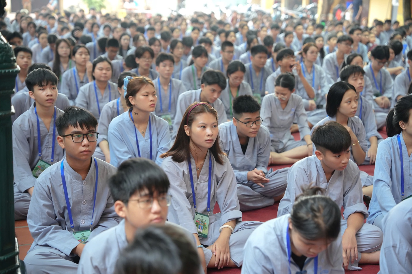 A group of people sitting on the floor AI-generated content may be incorrect.