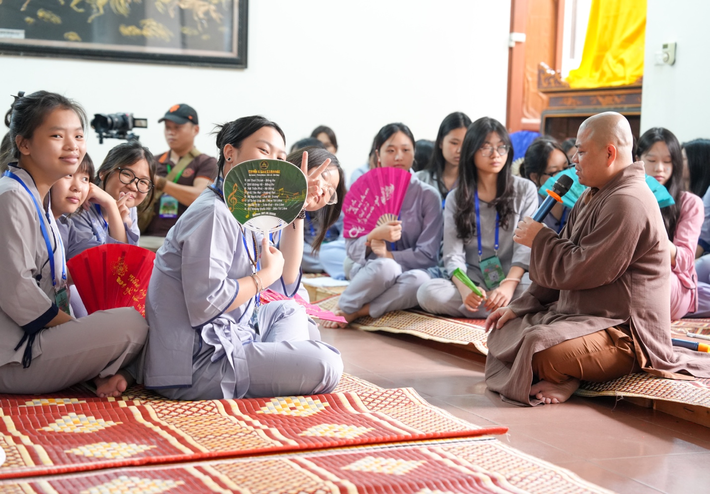 A group of people sitting on the floor AI-generated content may be incorrect.