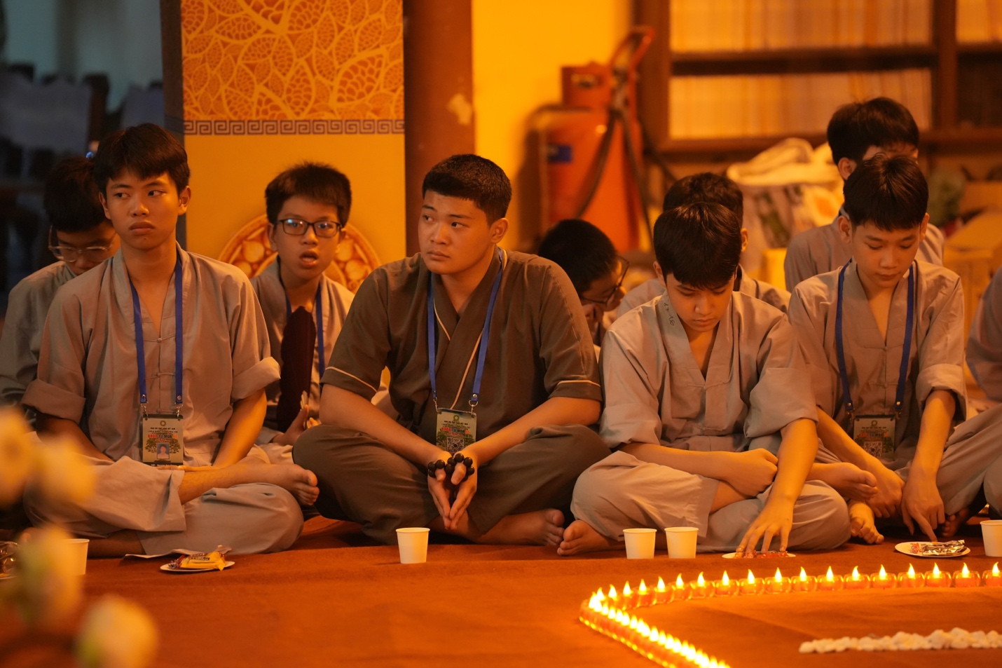 A group of people sitting on the floor AI-generated content may be incorrect.