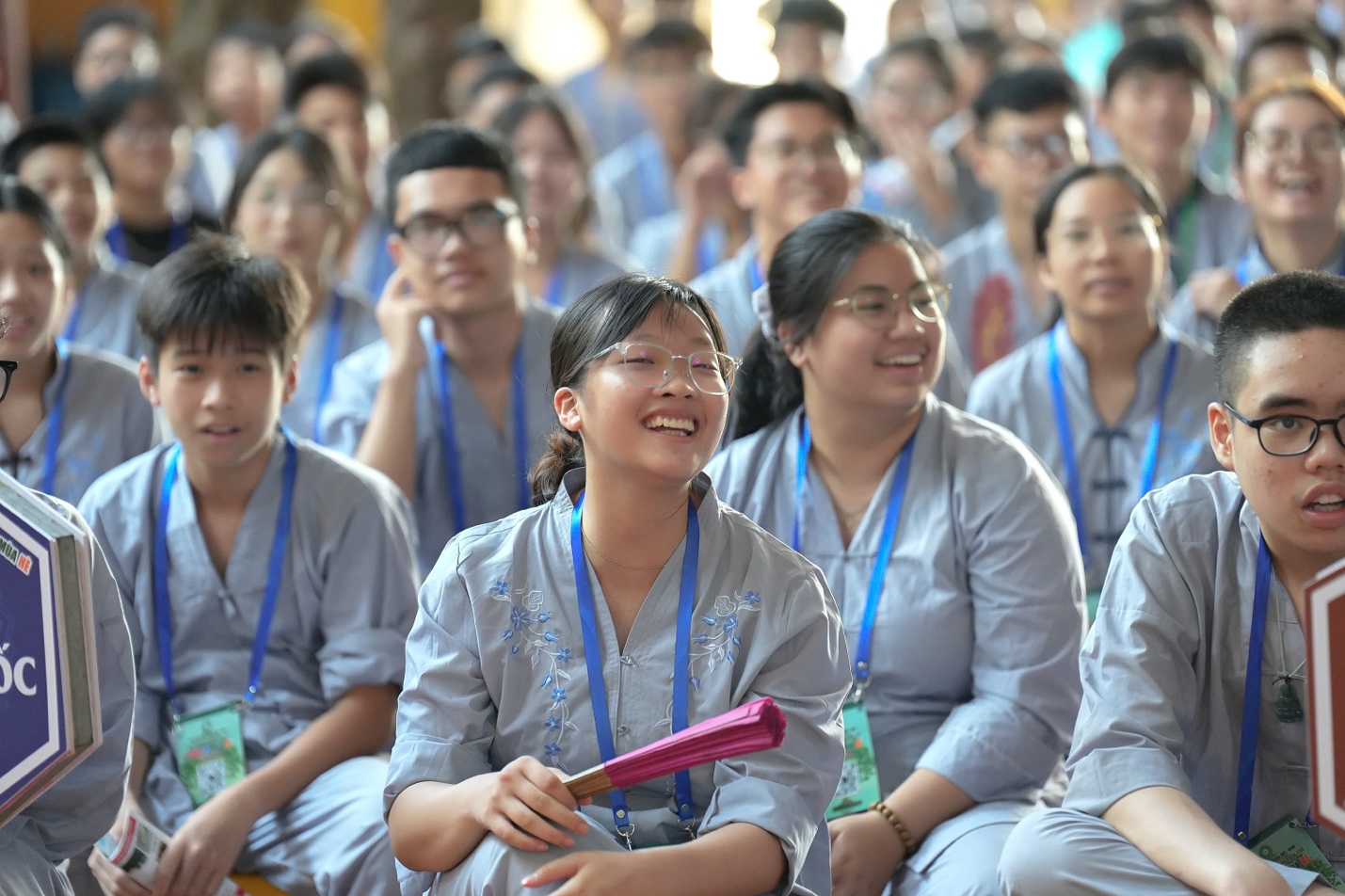 A group of people sitting together

AI-generated content may be incorrect.