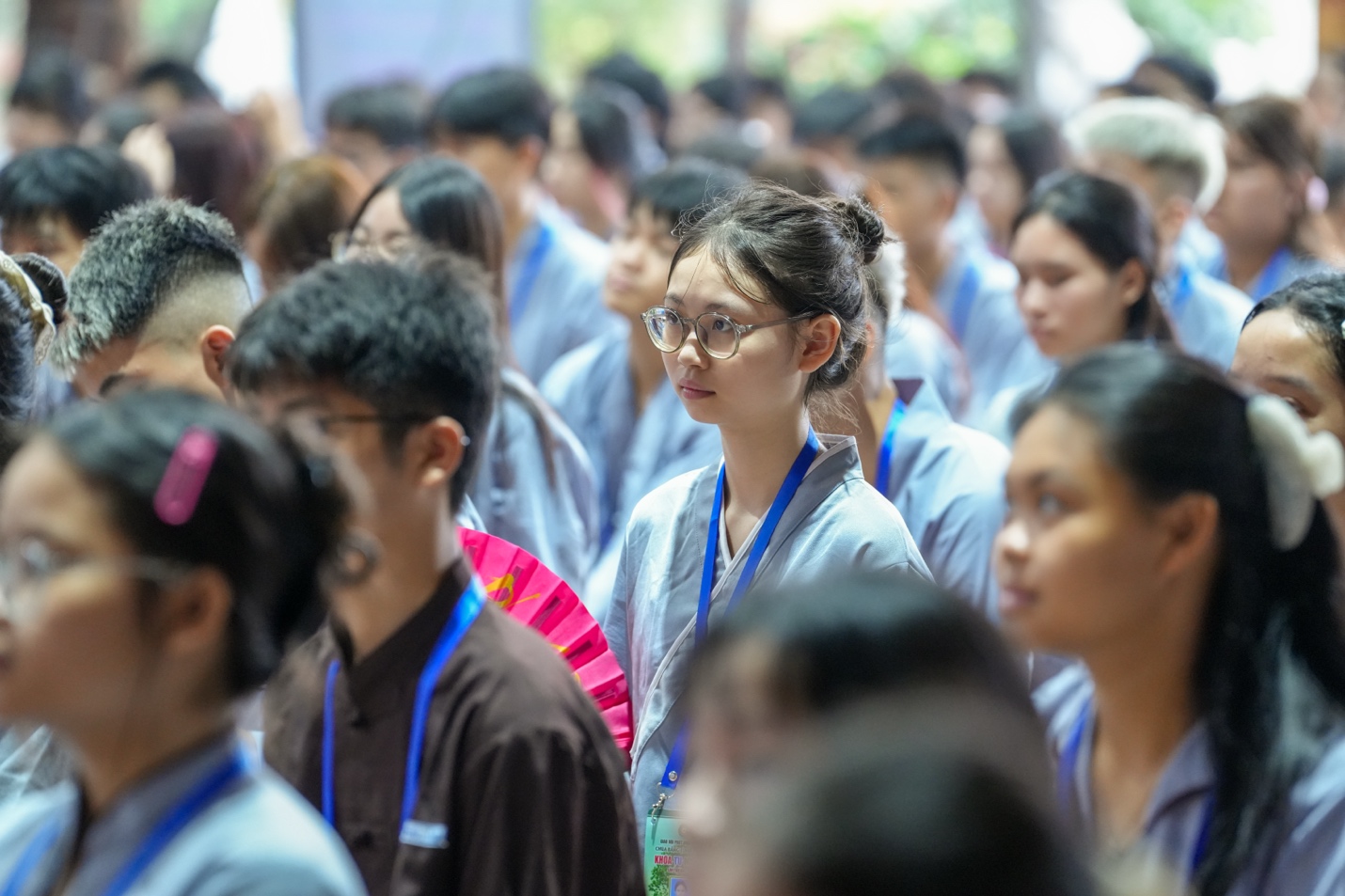 A group of people standing in a line AI-generated content may be incorrect.