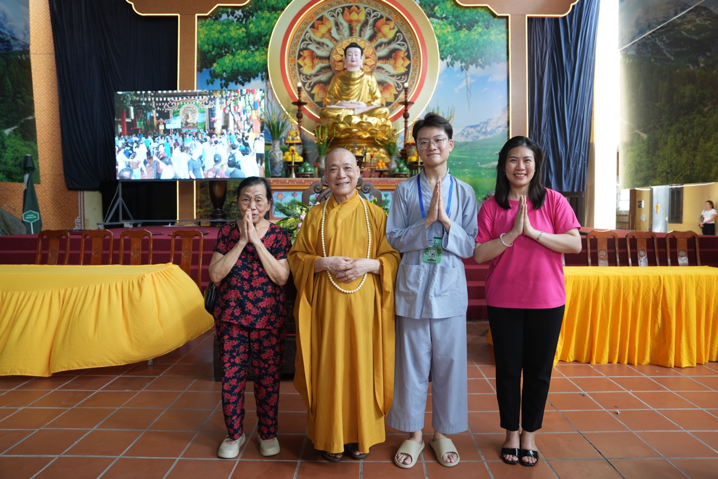 A group of people standing in front of a buddha statue AI-generated content may be incorrect.
