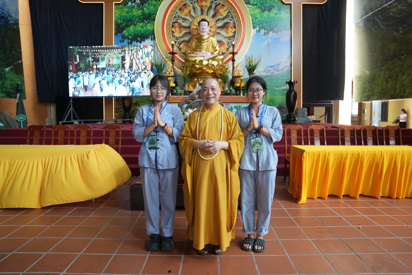 A group of people standing in front of a buddha statue AI-generated content may be incorrect.