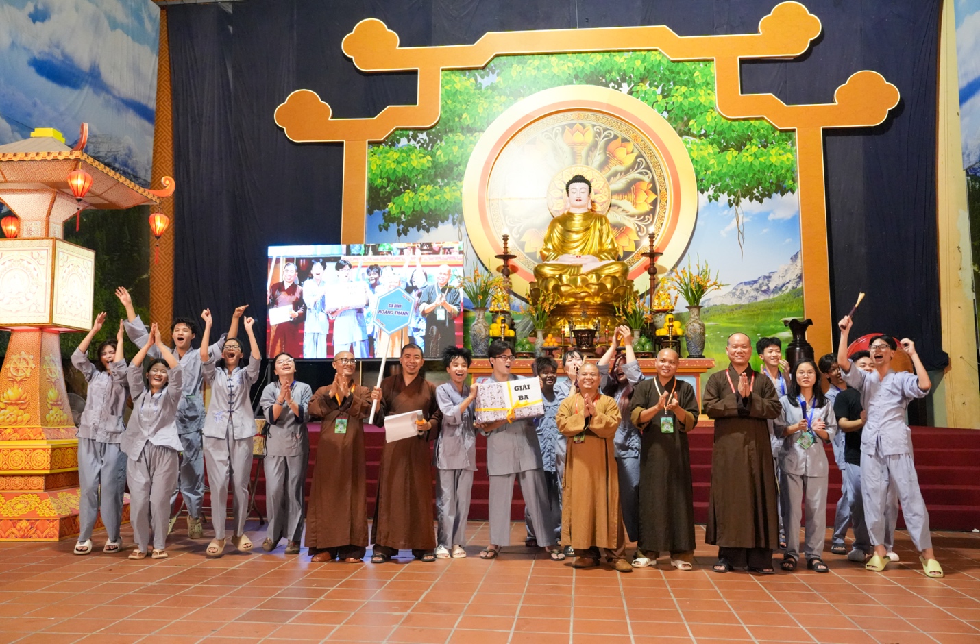 A group of people standing in front of a gold statue AI-generated content may be incorrect.