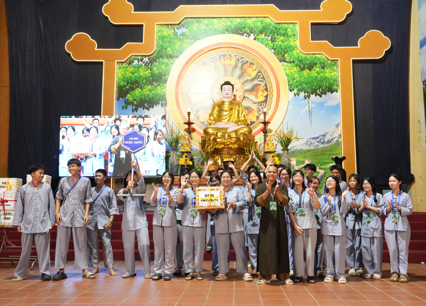 A group of people standing in front of a gold statue AI-generated content may be incorrect.