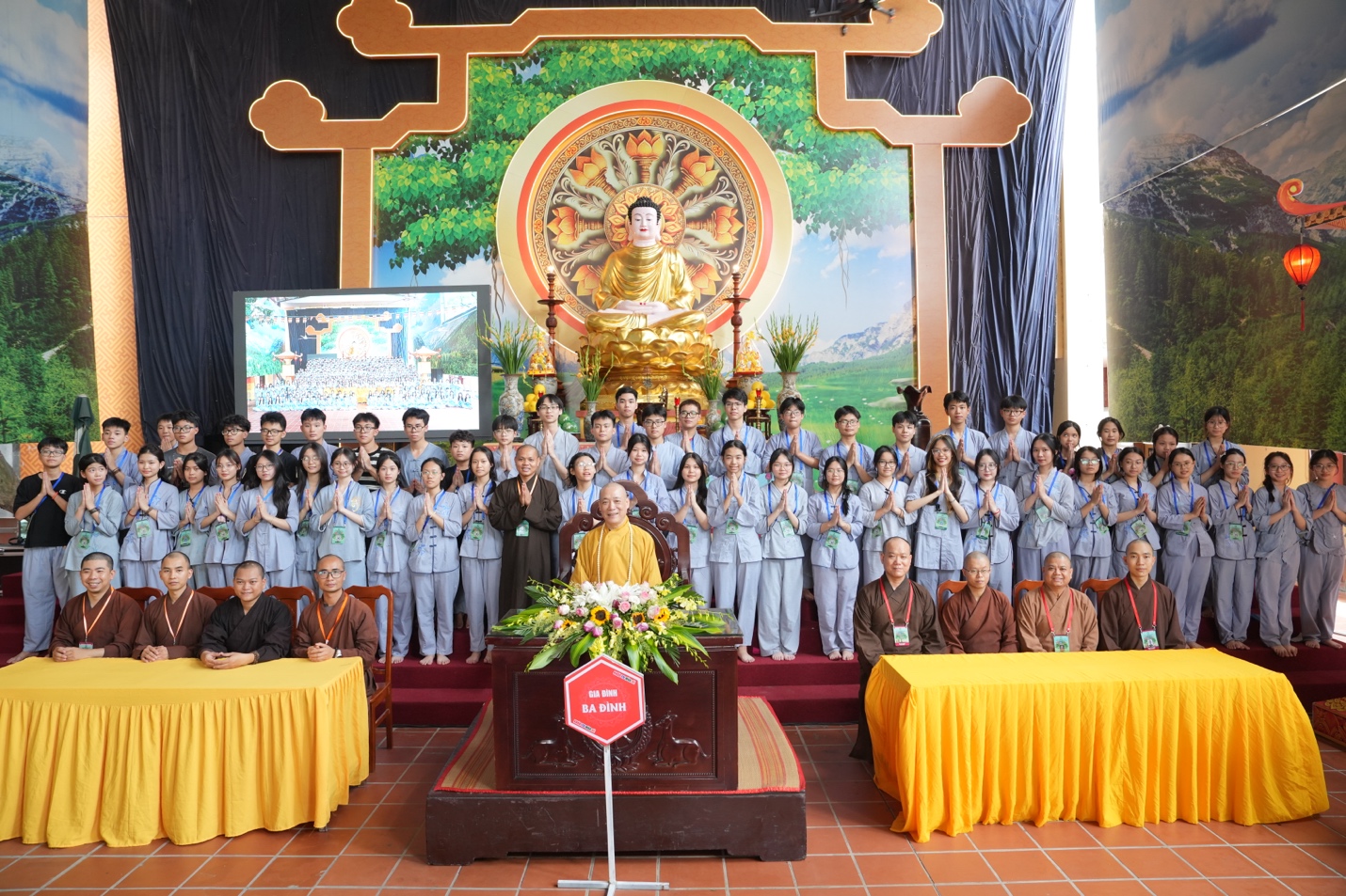A group of people standing in front of a large group of people AI-generated content may be incorrect.