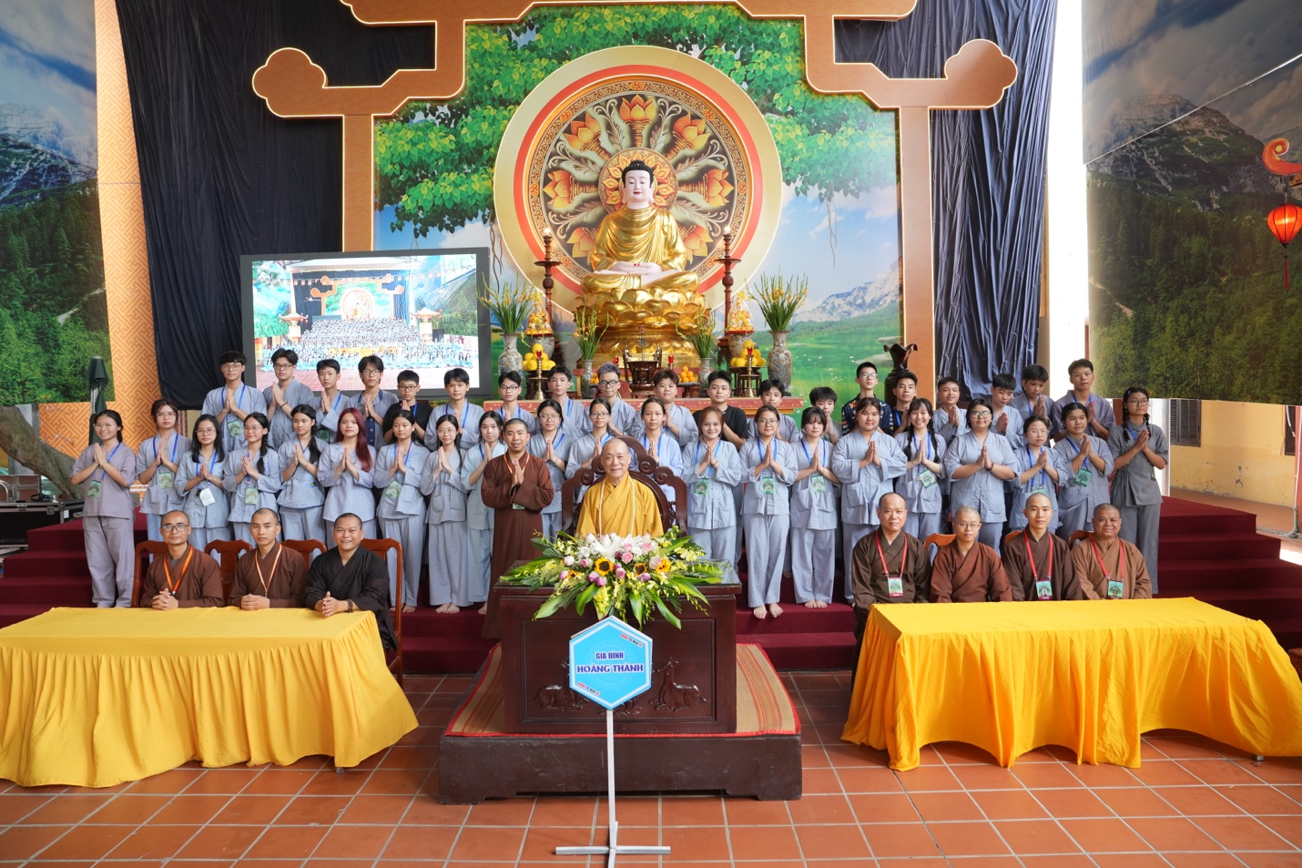 A group of people standing in front of a large group of people AI-generated content may be incorrect.