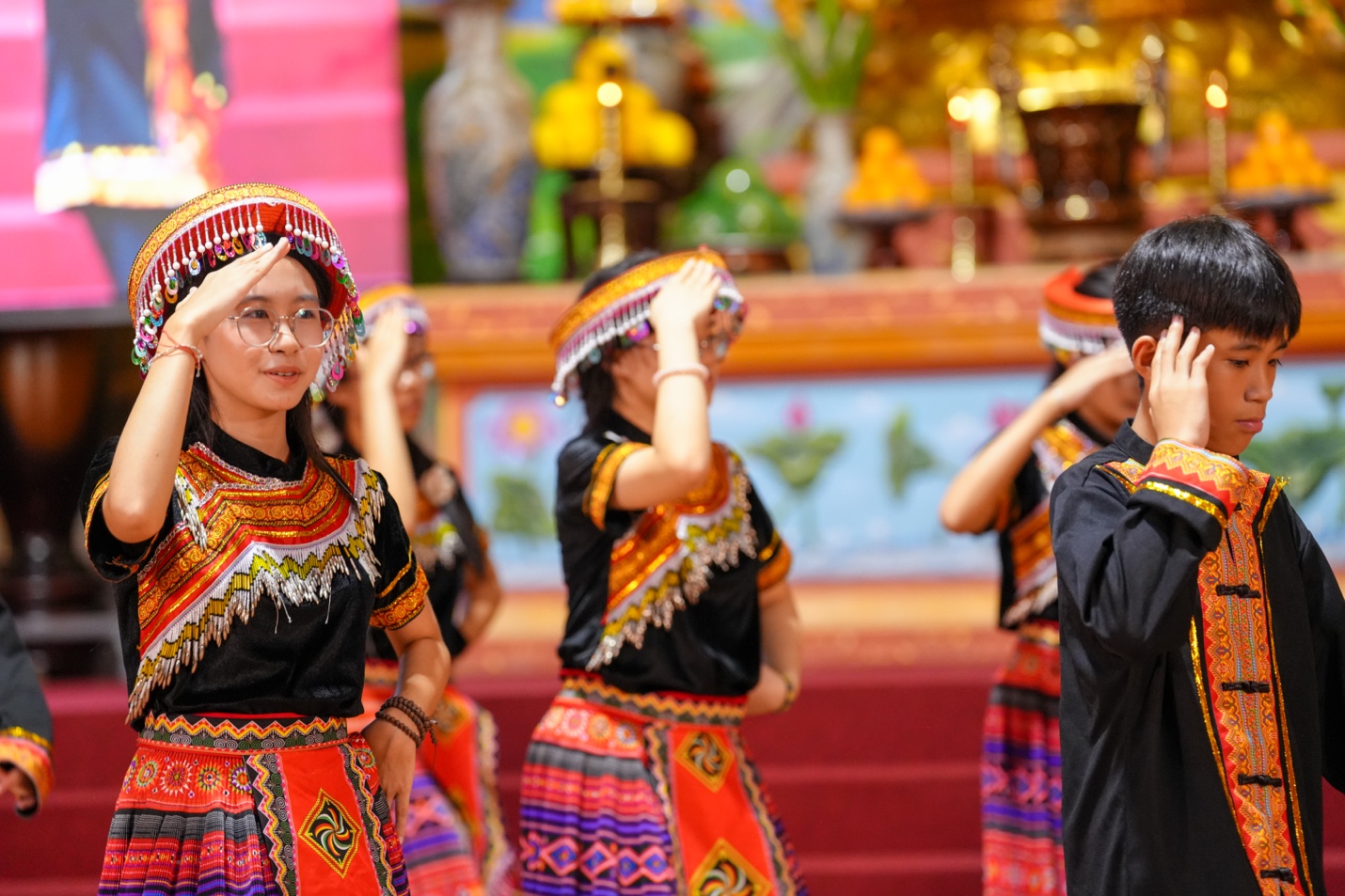 A group of people wearing colorful clothes AI-generated content may be incorrect.