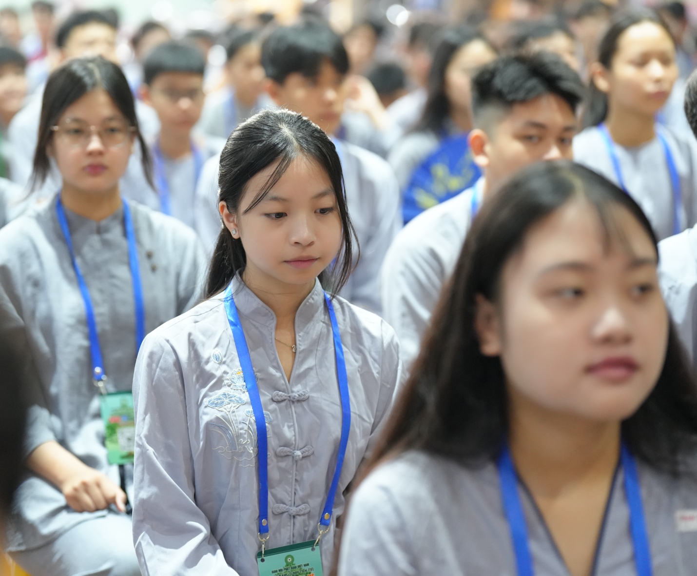 A group of people wearing lanyards AI-generated content may be incorrect.