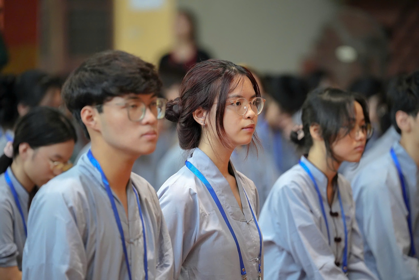 A group of people wearing lanyards AI-generated content may be incorrect.